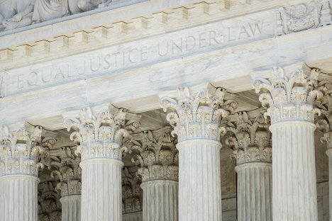 The US Supreme Court Building columns with the words Equal Justice Under Law on the building.